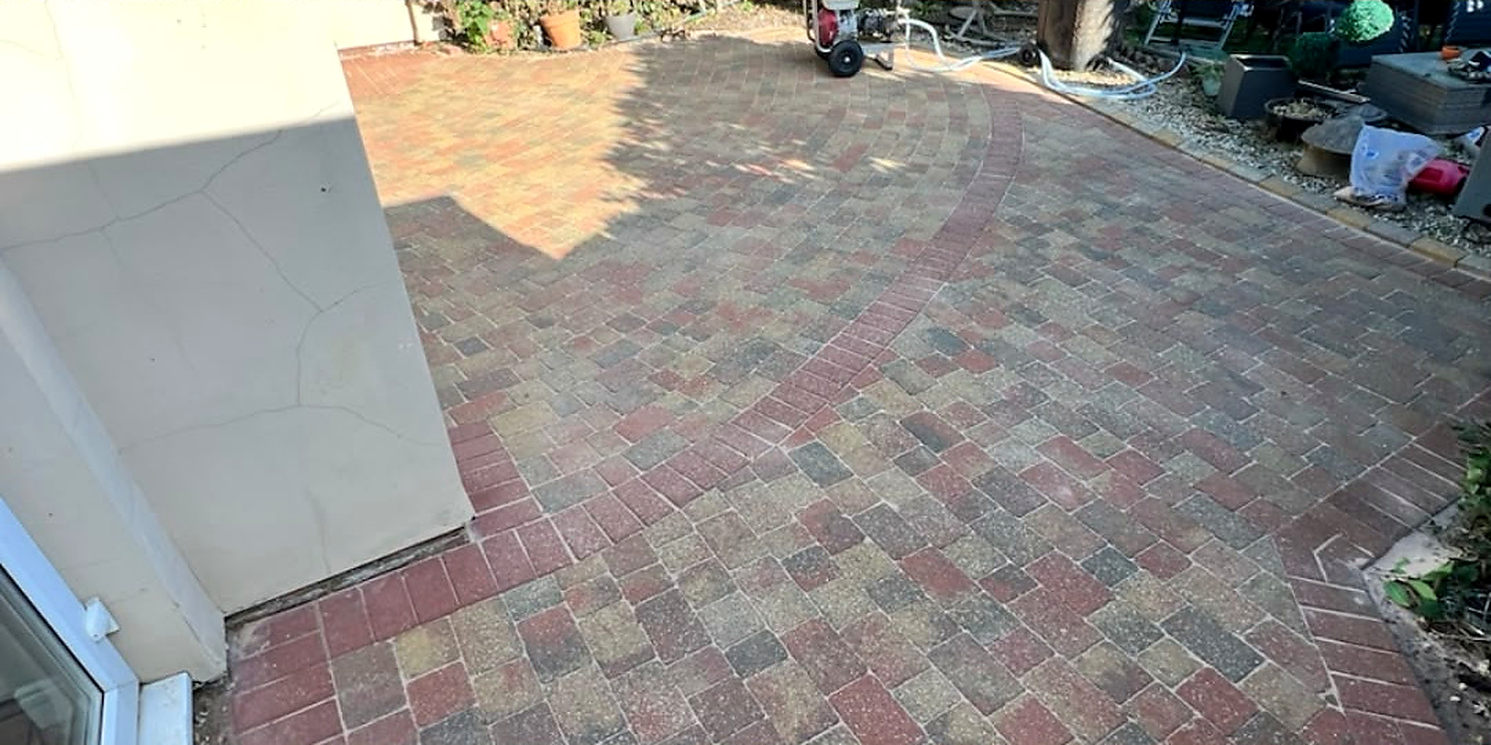 Circular brick paved patio cleaned — after