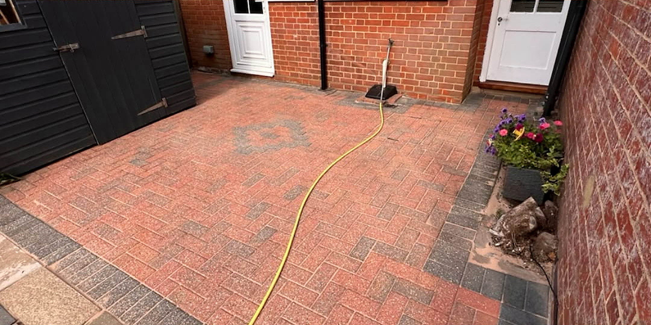 Rear brick courtyard cleaned — after