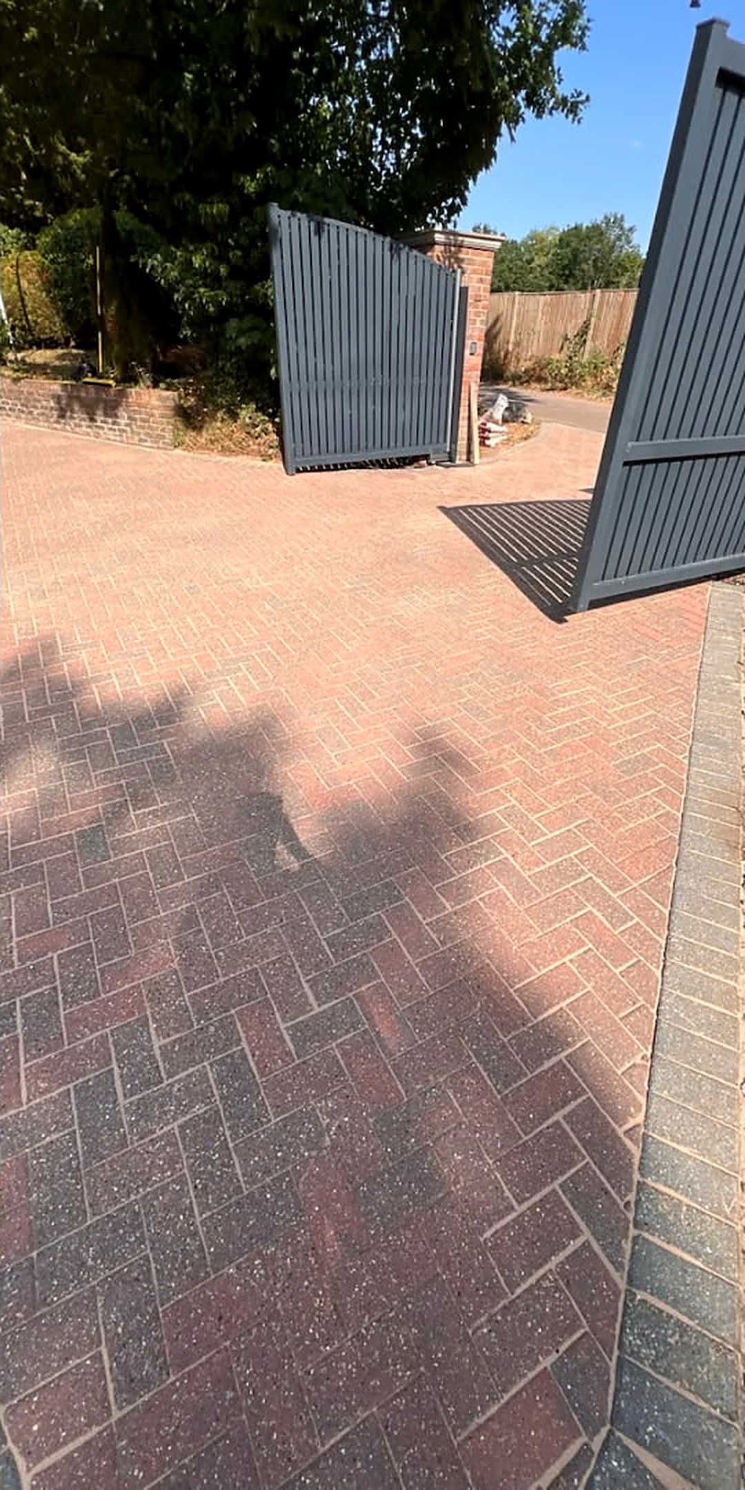 Block paved gated entrance deep cleaned — after