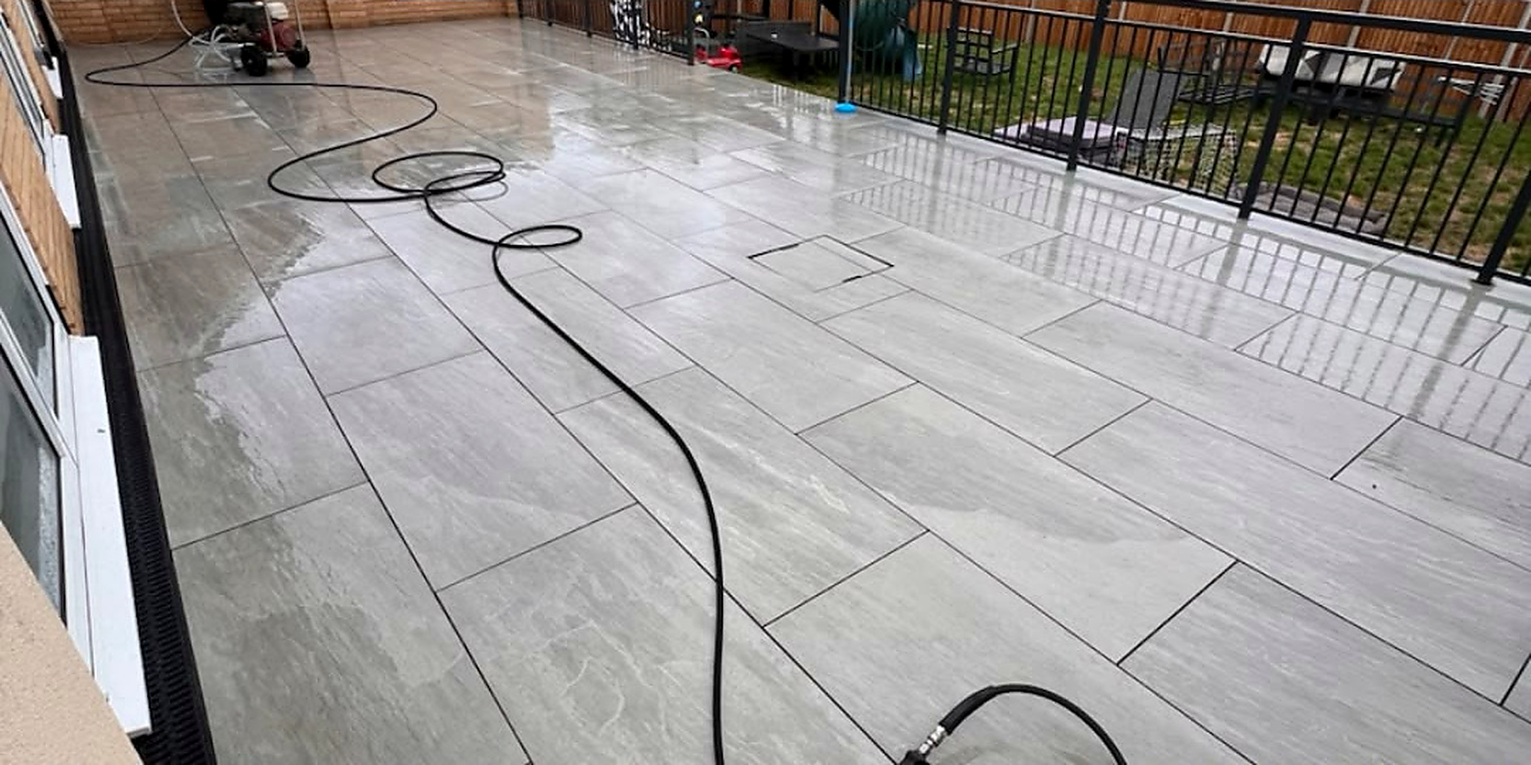 Grey porcelain terrace cleaned — after