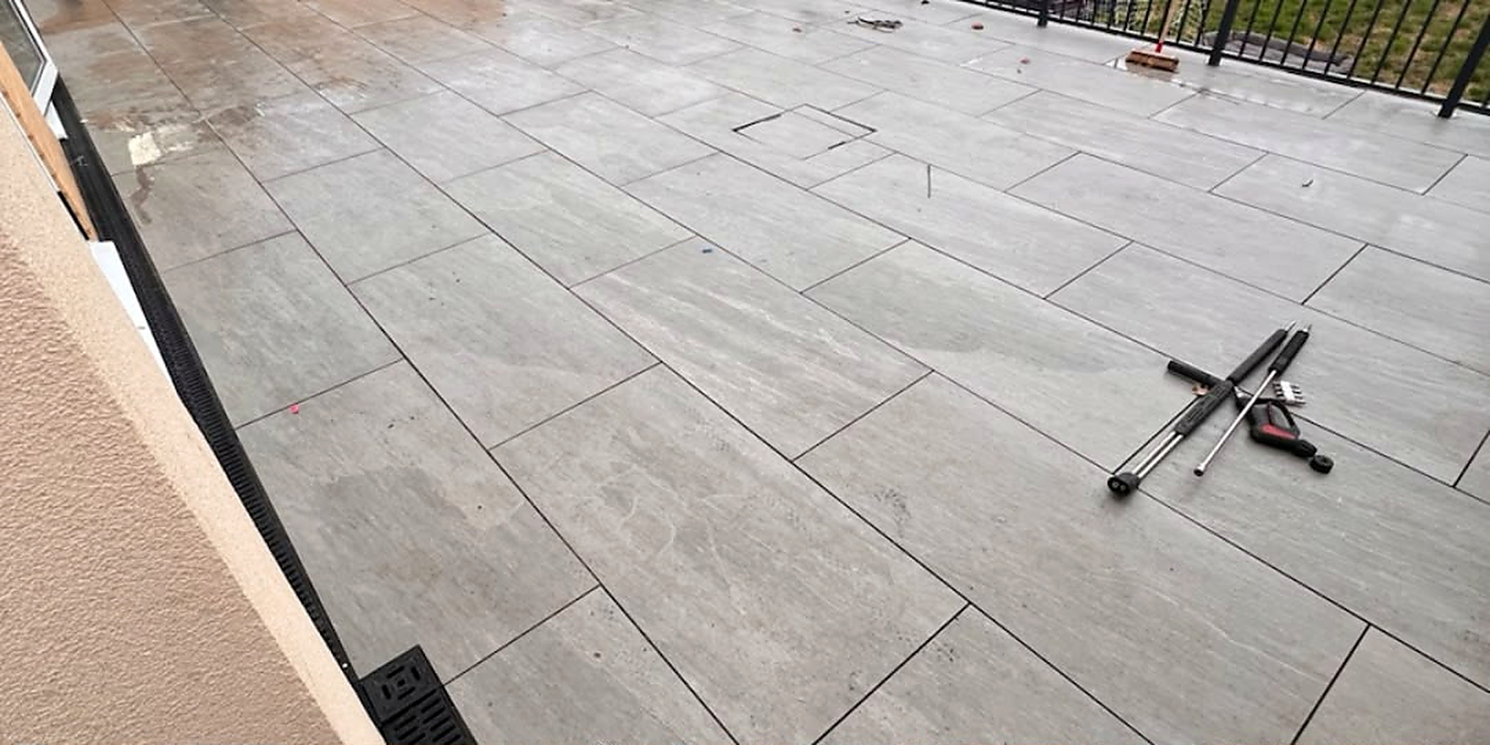 Grey porcelain terrace cleaned — before